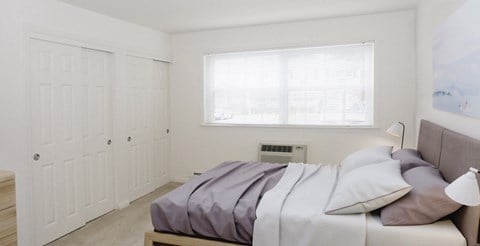 perfectly made bed large closets at Heatherwood House at Oakdale, Bohemia, NY