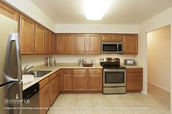 large open floor plan kitchen at Heatherwood House at Patchogue, New York