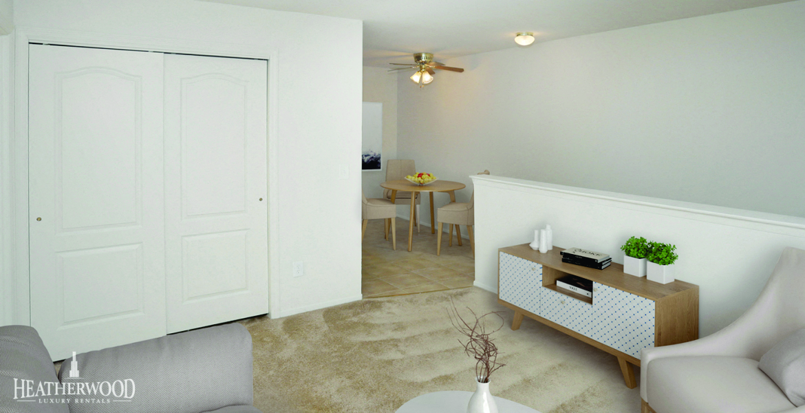 living room set with closets visible at Lakeside Village, East Patchogue, New York