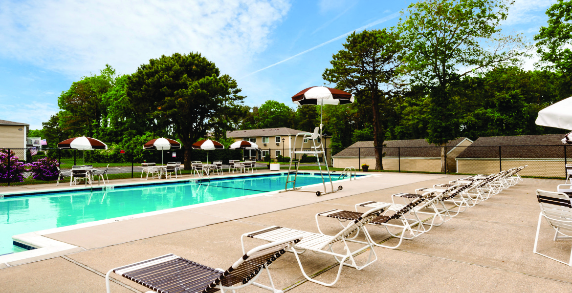 in ground pool and lounge chairs at Lakeside Village, East Patchogue