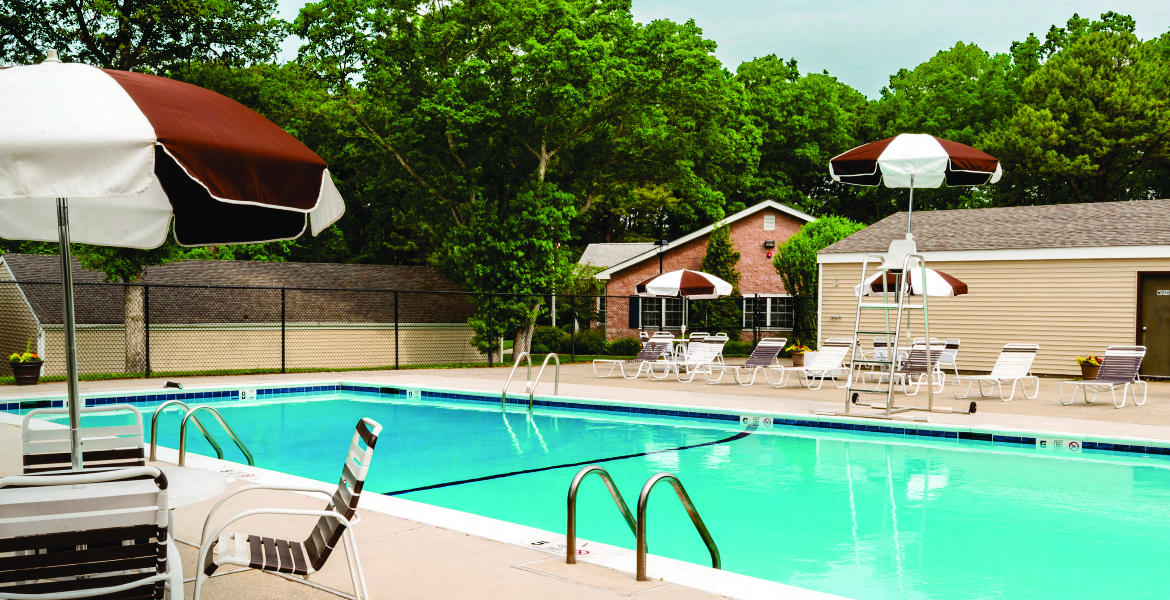 outdoor pool and sundeck with umbrellas at Lakeside Village, New York