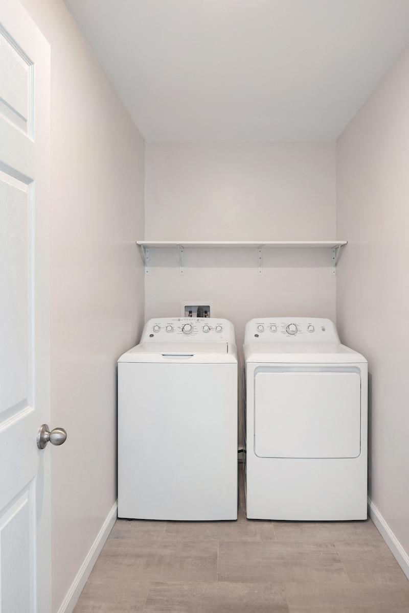 Laundry room at Heritage Oyster Bay, East Norwich, NY
