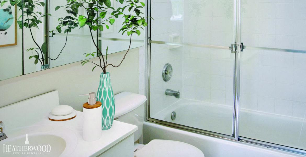 bathroom with glass shower doors at Mirror Pond, New York, 11955