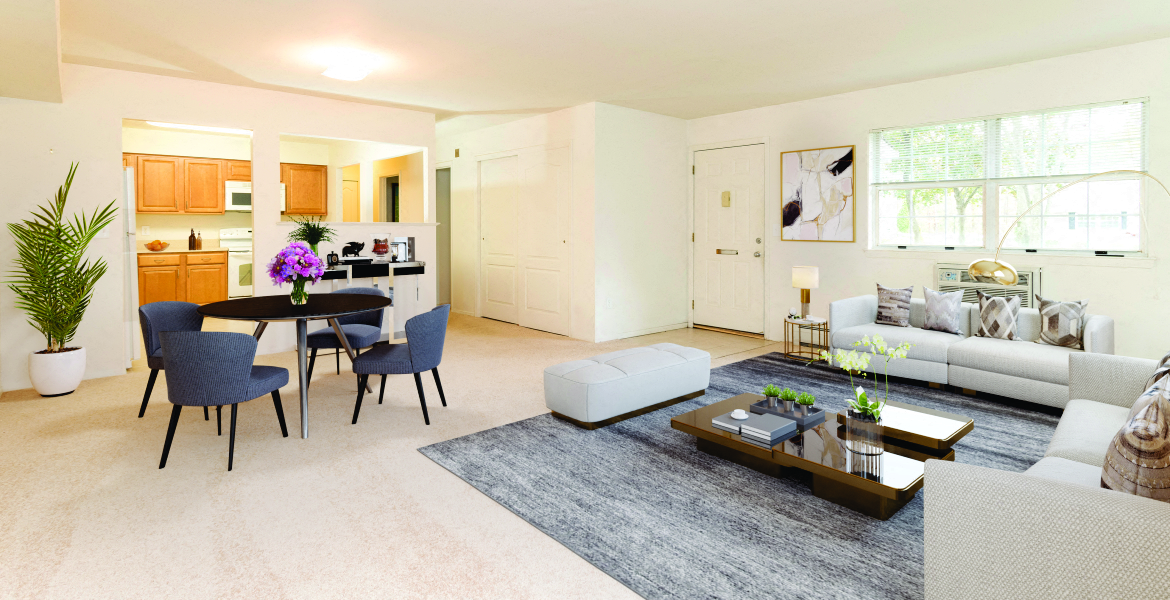 a living room with a couch and a table