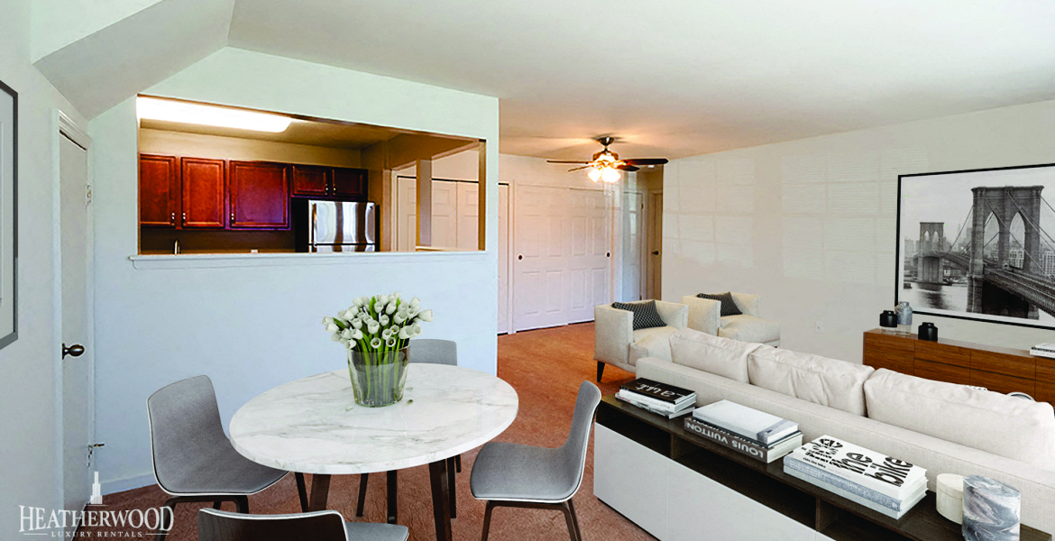 a living room with a white couch and a table