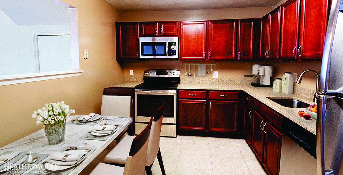 kitchen with cherrywood cabinetry at Spruce Pond, New York