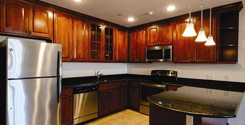 beautiful kitchen with cherrywood cabinets and stainless steel appliances at Gerard Street Apartments, Huntington, 11743
