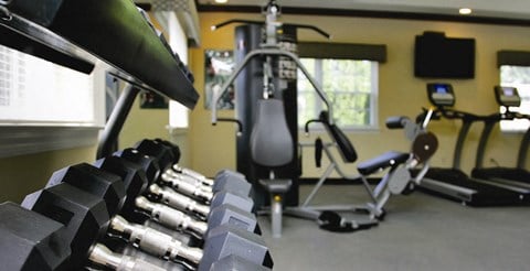 free weights in  gym at Villas at Pine Hills, Manorville