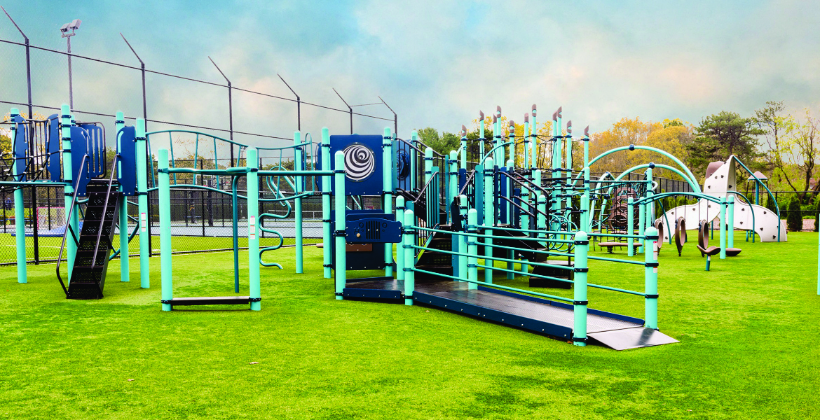 playground jungle gym in green at Villas at Pine Hills, New York, 11949