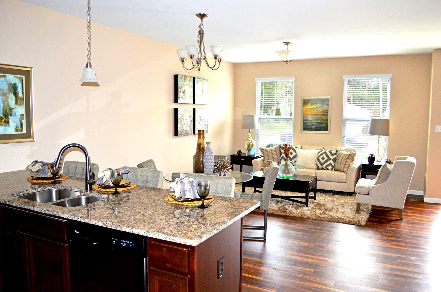 a kitchen and living room with a couch and a table