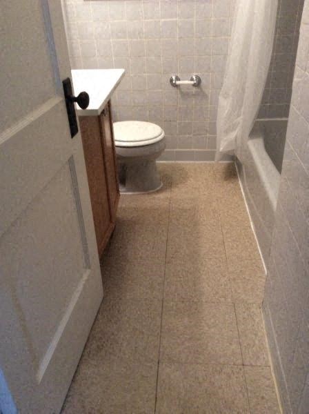 a small bathroom with a toilet and a shower