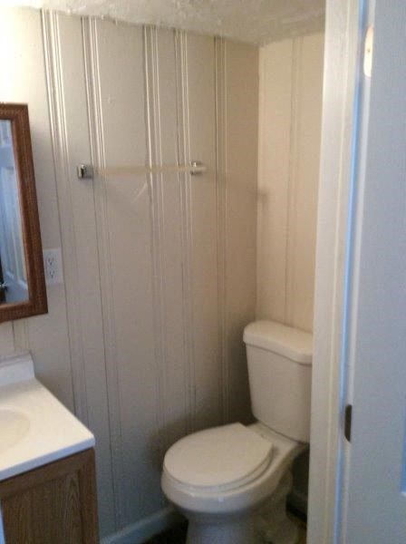 a small bathroom with a toilet and a shower