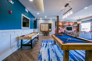 Resident Game Room with Billiards, Shuffleboard and Wall Scrabble at Phoenix Studio Apartments - Photo Gallery 16