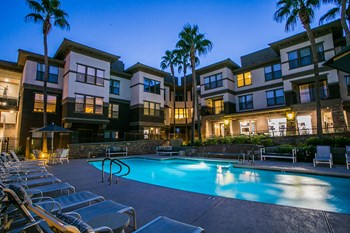 Pool Lounge Seating at Apartments Near Desert Ridge Arizona - Photo Gallery 18