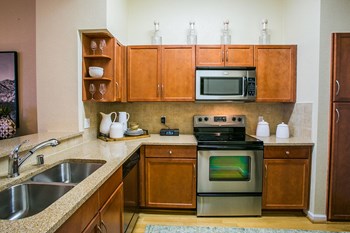 Full Kitchen with Cherry or Maple Cabinetry at Apartments on Union Hills AZ - Photo Gallery 5
