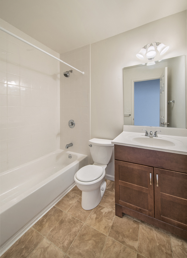 the preserve at ballantyne commons apartment bathroom with tub sink and toilet