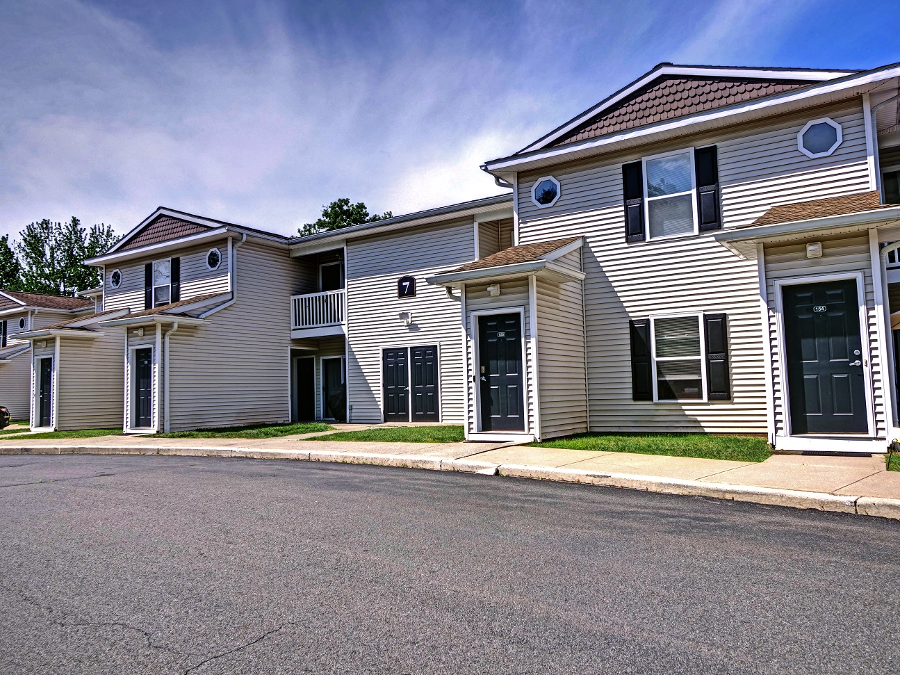 a row of houses on the side of a street