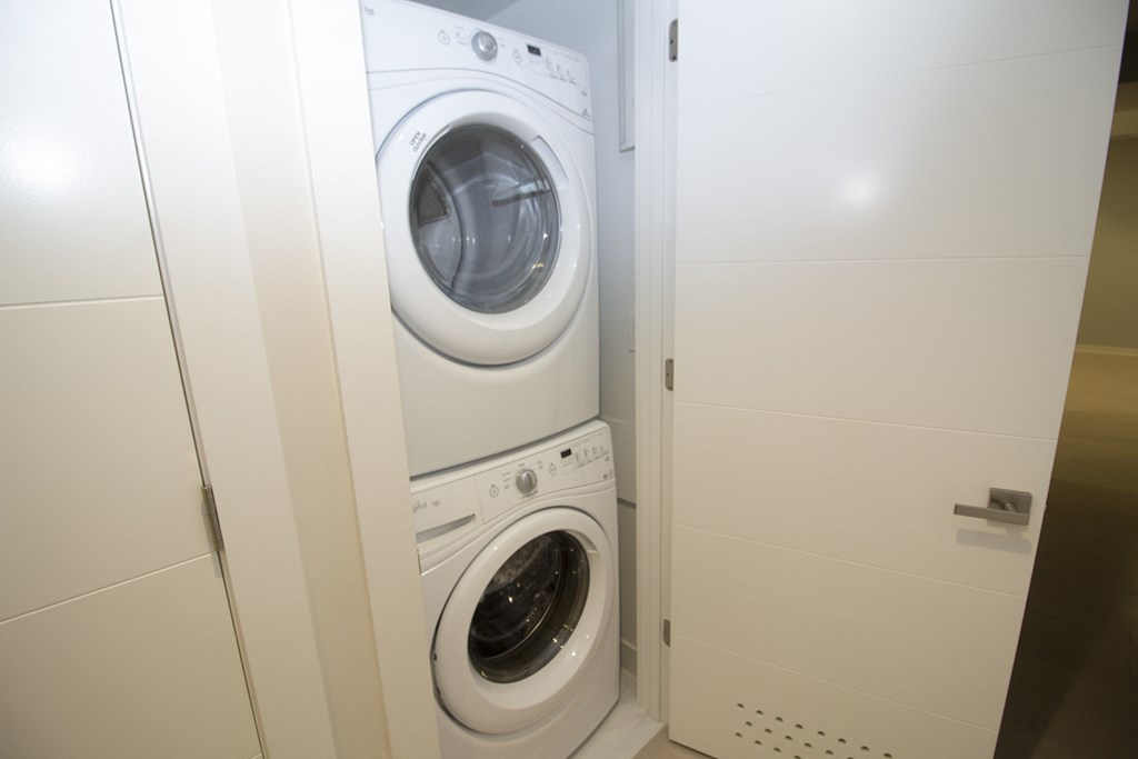 a washing machine and dryer in a laundry room