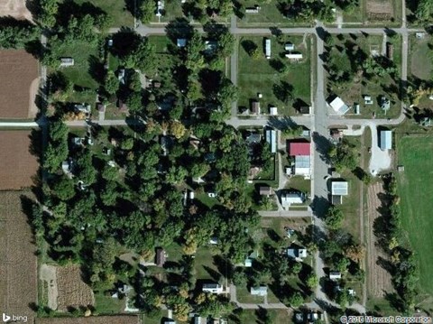 an aerial view of a neighborhood with trees and houses