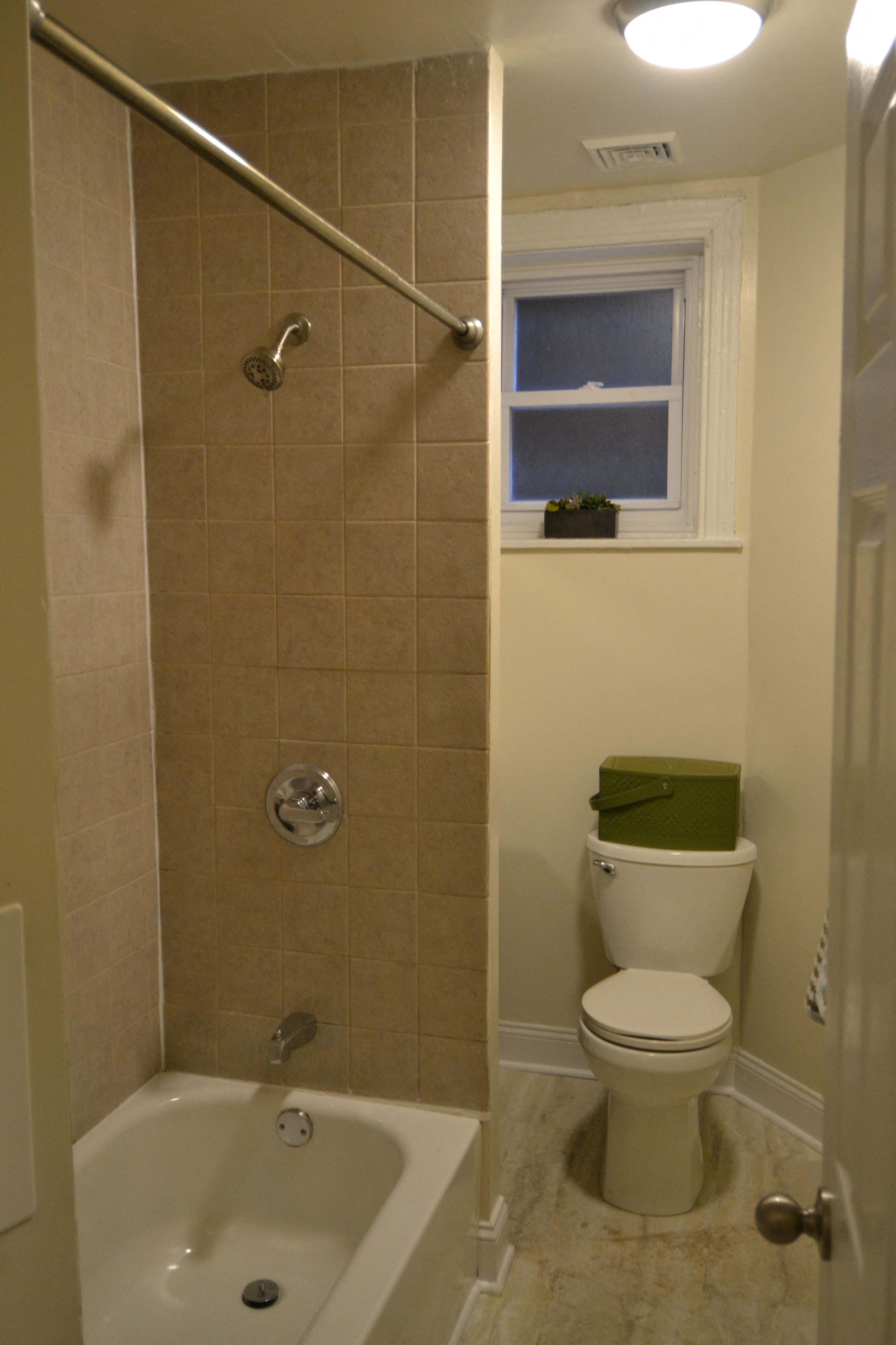 a small bathroom with a shower and a toilet