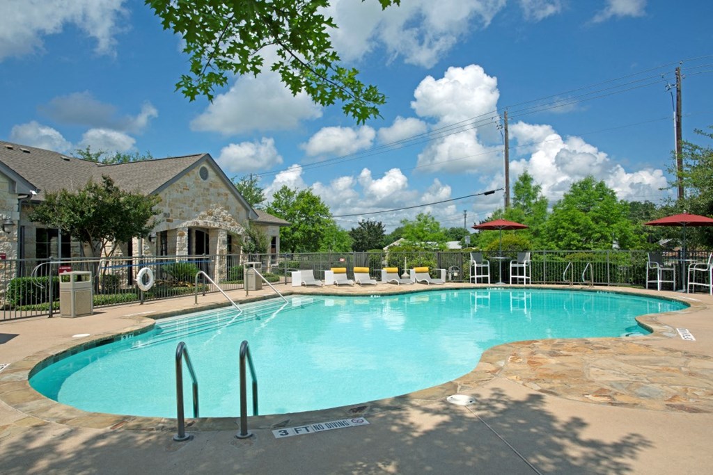 Pool side with walk in rails to the pool