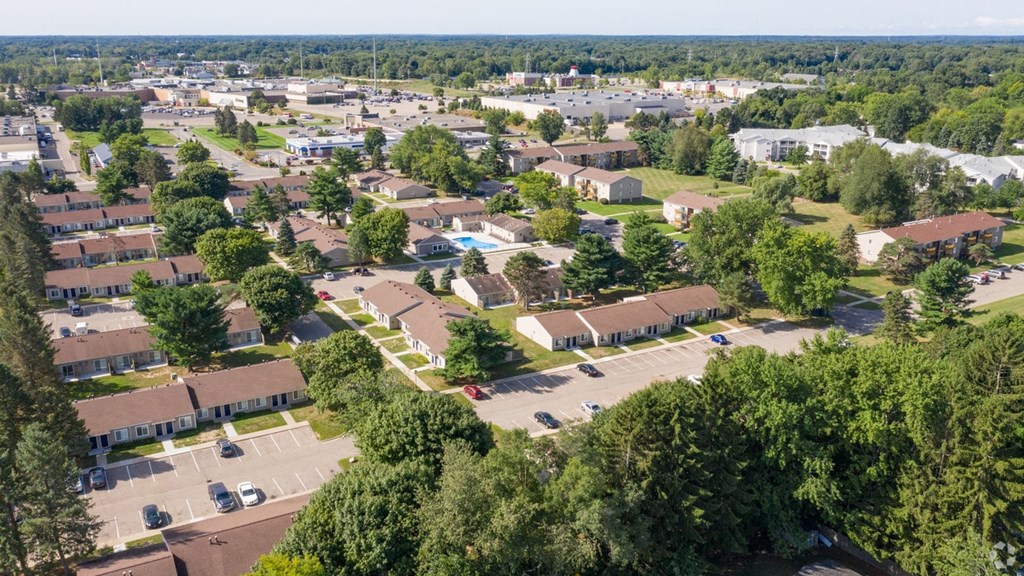 an aerial view of a suburban neighborhood with houses and trees