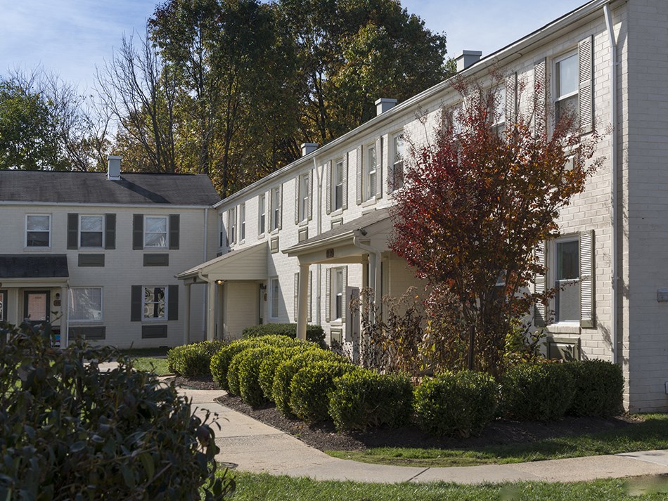 a building with a sidewalk in front of it
