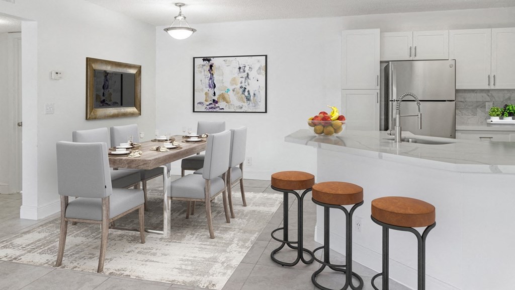 a kitchen and dining room with a table and stools