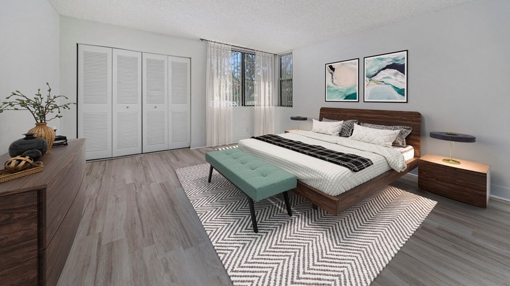 a bedroom with a bed and a rug