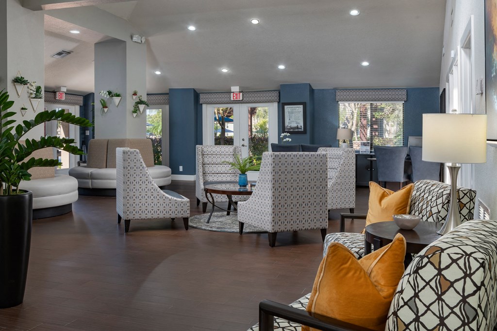 a living room with couches and chairs and a table