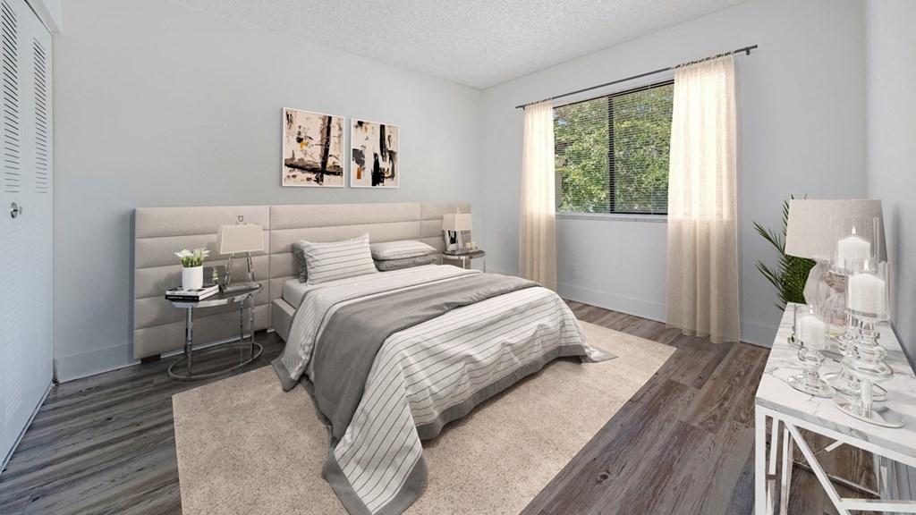 a bedroom with a bed and a window