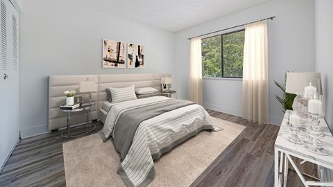 a bedroom with a bed and a window