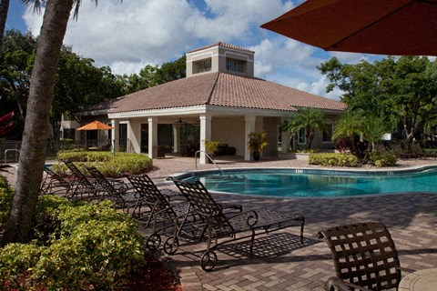 the pool is in front of the clubhouse at the resort