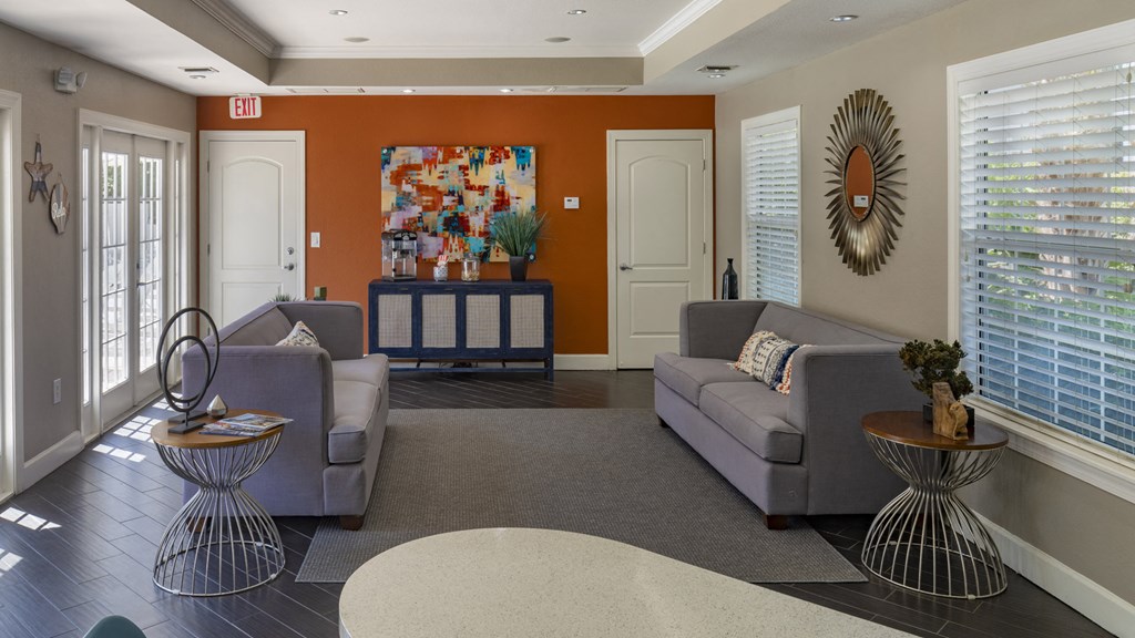 a living room with couches and a table