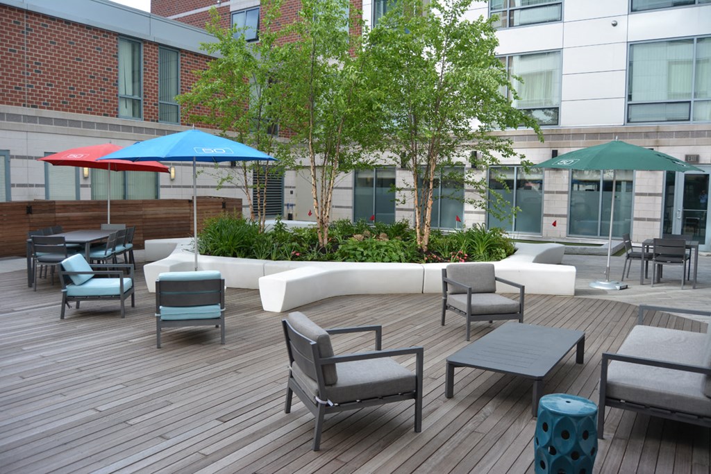 a large patio with tables and chairs and umbrellas