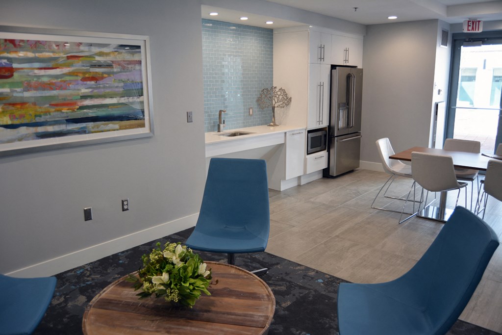 a kitchen and dining room with a table and chairs