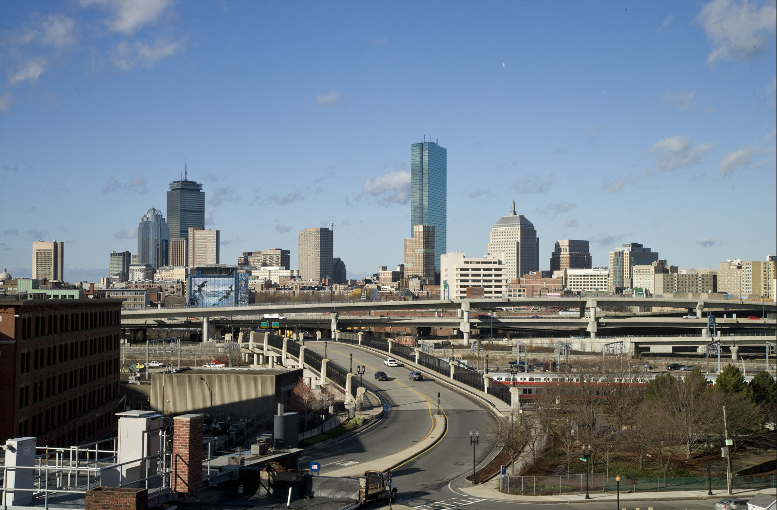 a view of the city with highways and buildings