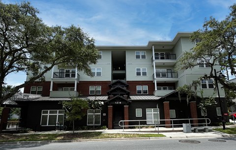 a large apartment building with a street in front of it