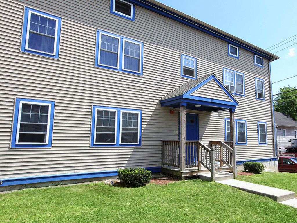 the front of a house with a porch
