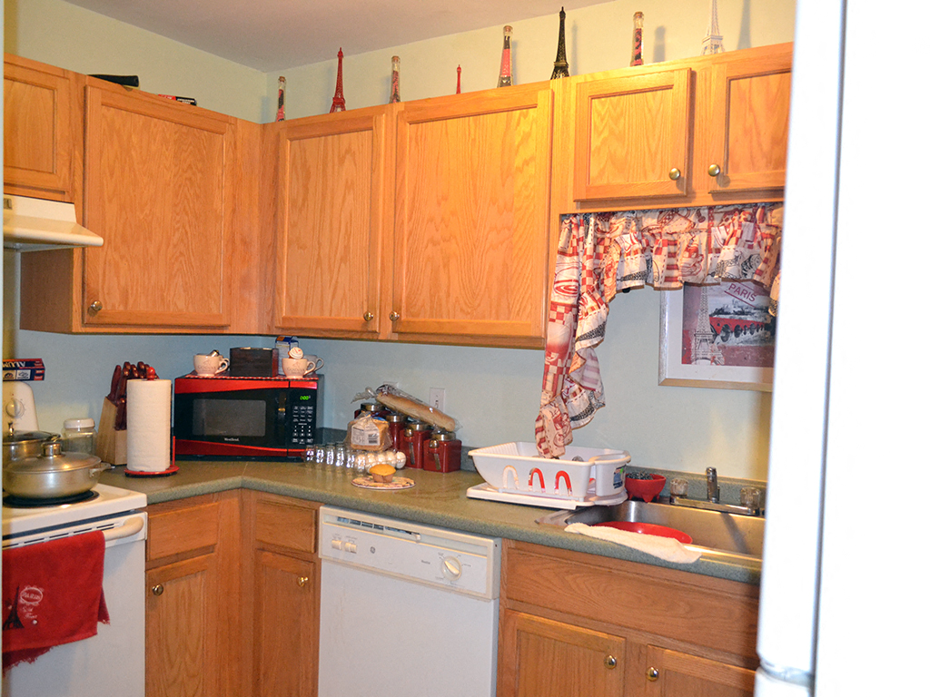 a kitchen with wooden cabinets and a sink