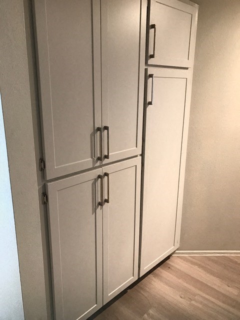 a row of white cabinets in a room