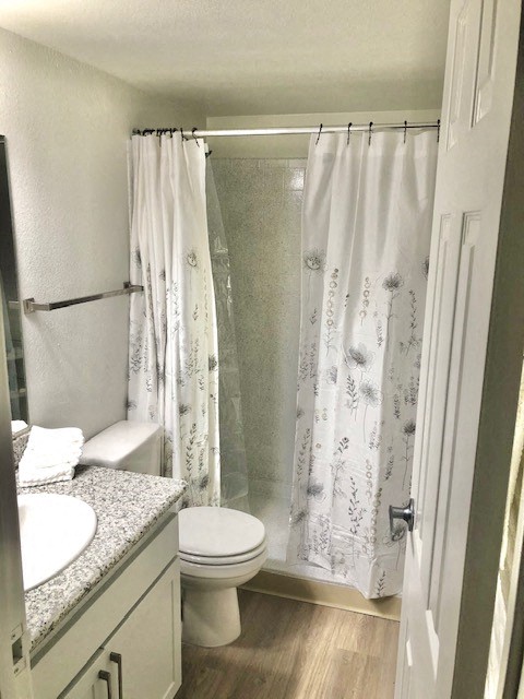 a small bathroom with a toilet and a shower