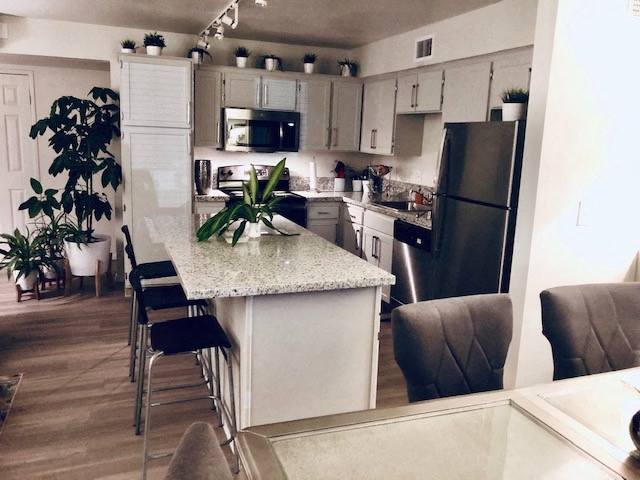a kitchen with a marble counter top