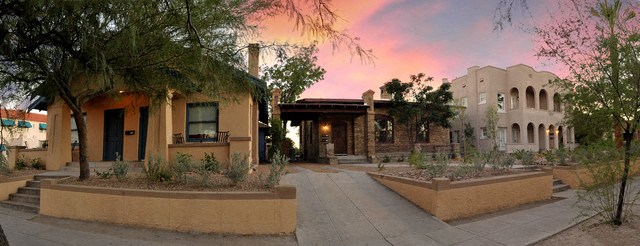 a building with trees and plants in a courtyard
