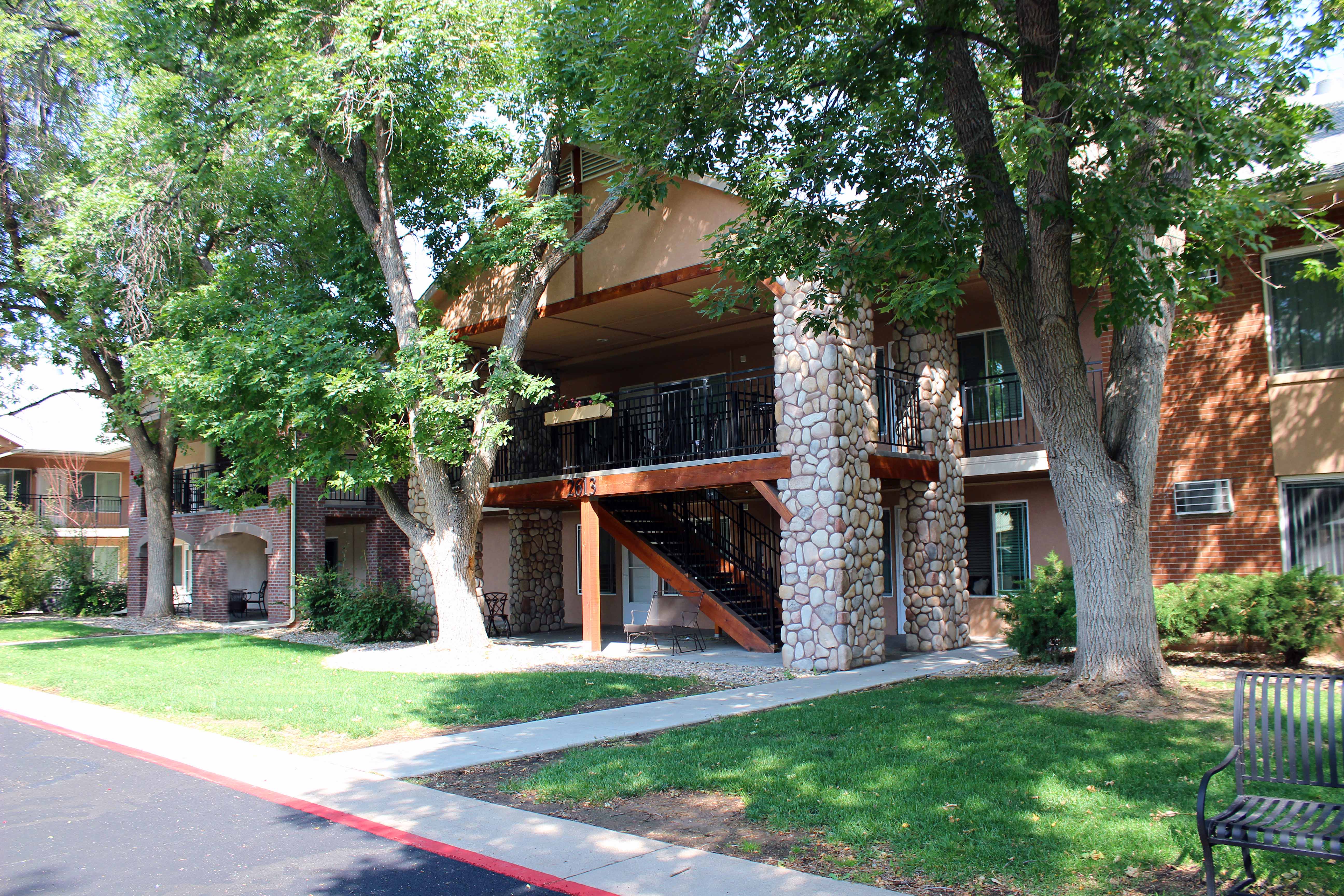 Village on Stanford exterior features trees and green lawns