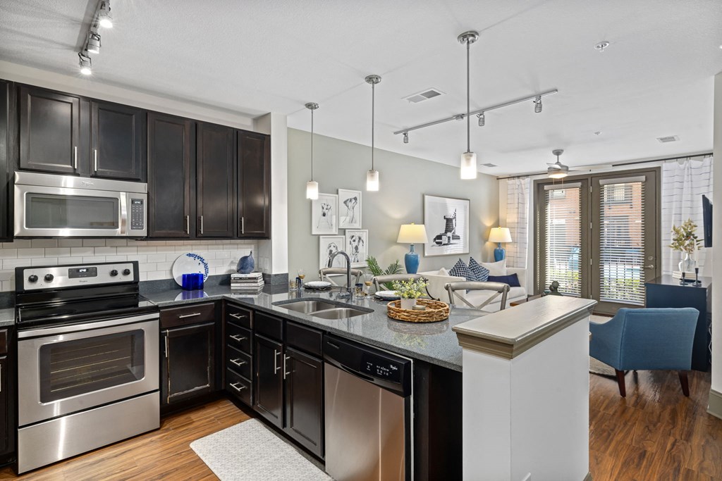 a kitchen with stainless steel appliances and a counter top