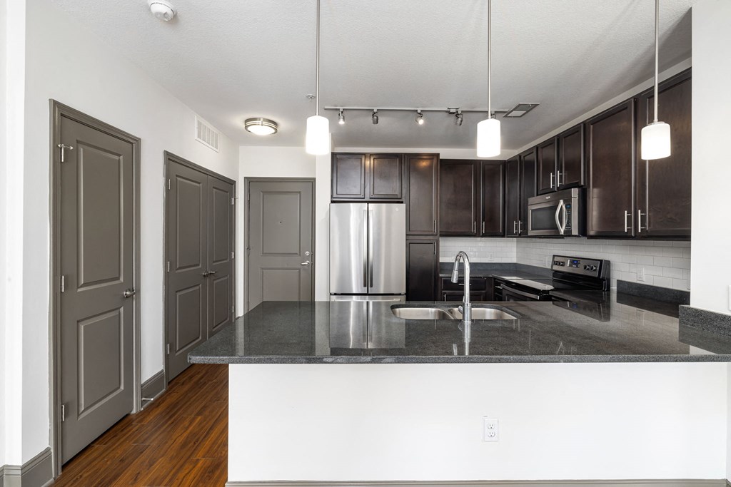 a kitchen with a granite counter top and