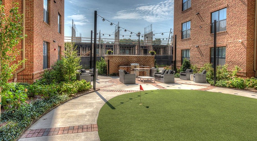 a backyard with a mini golf course