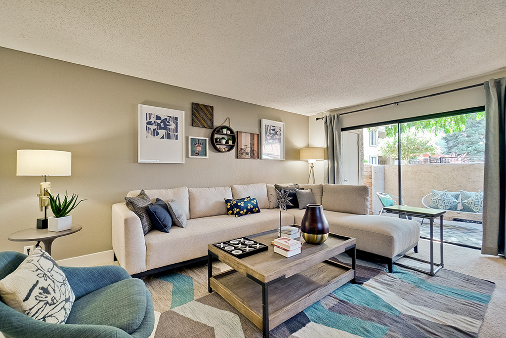 Apartments In San Jose, CA, For Rent - Villas Willow Glen - Open Floor Living Room With High Ceilings, Carpet Flooring, And A Floor To Ceiling Sliding Glass Door That Leads To Your Own Private Patio Space