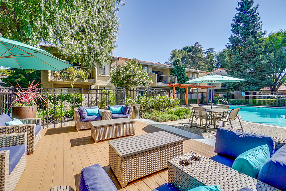 Pet-Friendly Apartments in San Jose, CA - Villas Willow Glen - Pool Area Lounge with Patio Furniture, Umbrellas, and Pool View